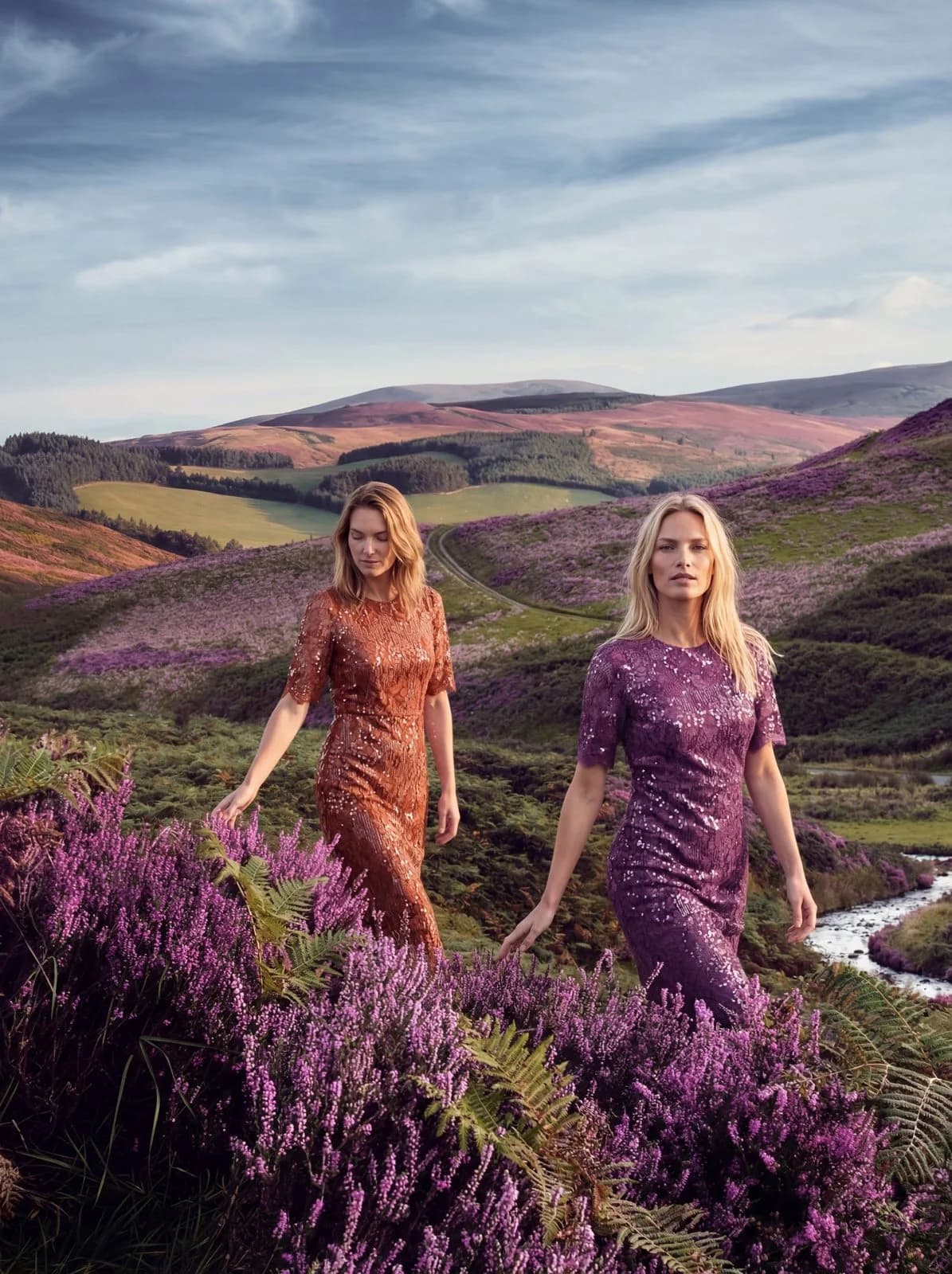 Cartolina: Two dresses in a field of purple flowers.