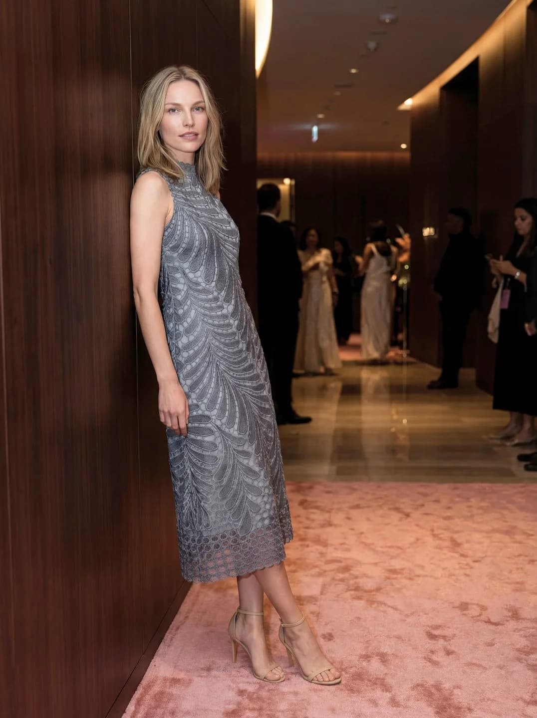 Cartolina: A patterned dress in a hotel corridor.