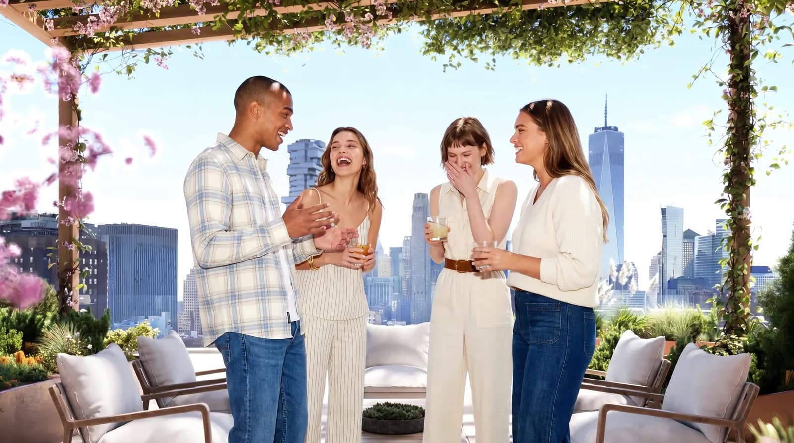 A group gathers beneath flowering plants on a terrace.
