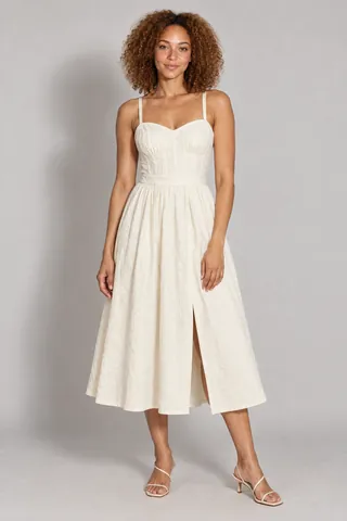 Product-page image of a model in the ivory sundress.