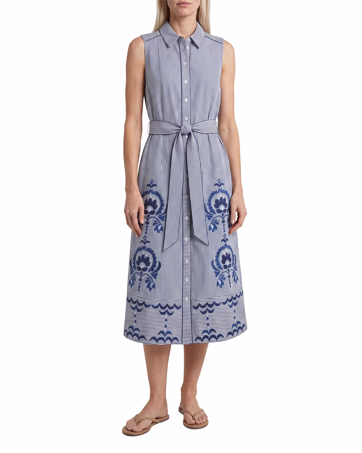 A model in Cartolina's Francesca midi shirtdress in blue floral stripe, on a white studio ground.