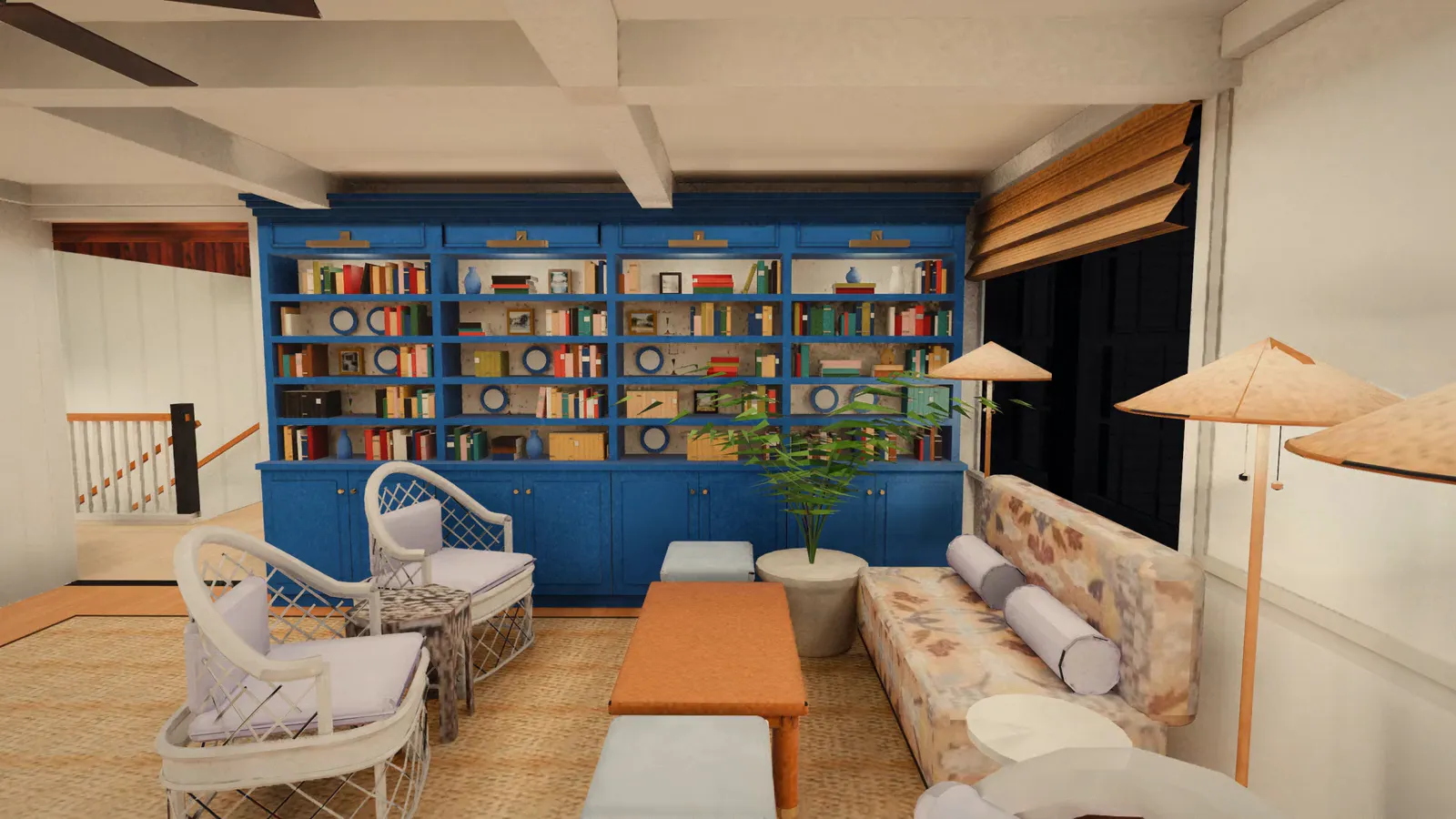 A slow move through a sitting room with navy built-in bookcases, white wicker chairs and a floral sofa.